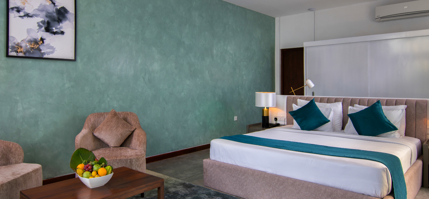 Sunrise Ridge Villa Interior - Bedroom with couch and coffee table with fruit basket