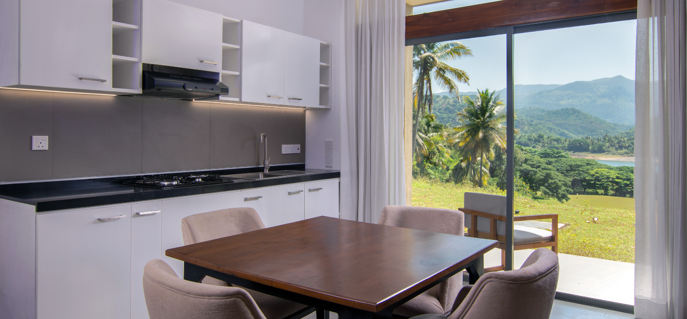 Sunrise Ridge Villa Kitchen and dining table with view of the mountains