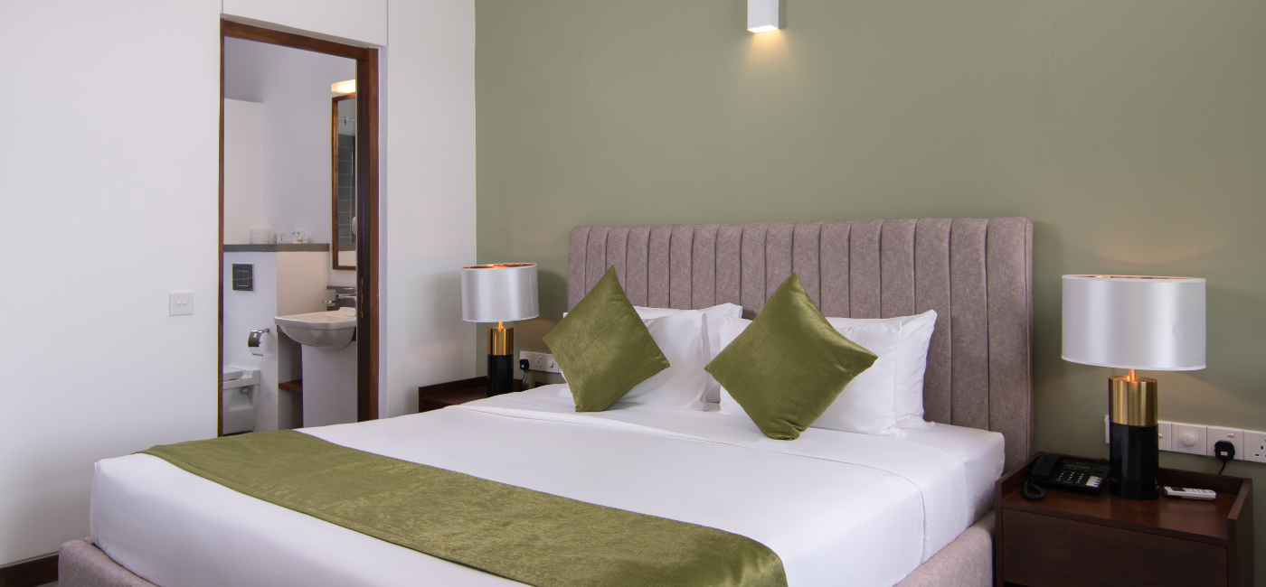 Sunrise Ridge Villa Room bed and attached washroom